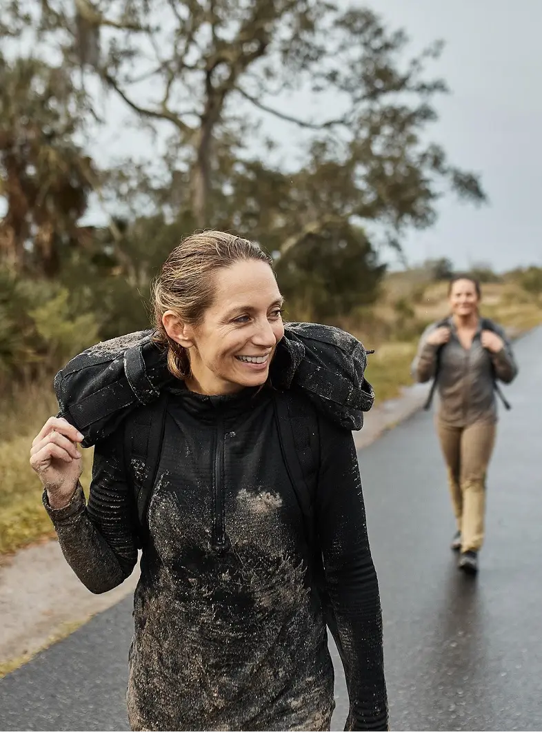 Woman walking with ruck pack