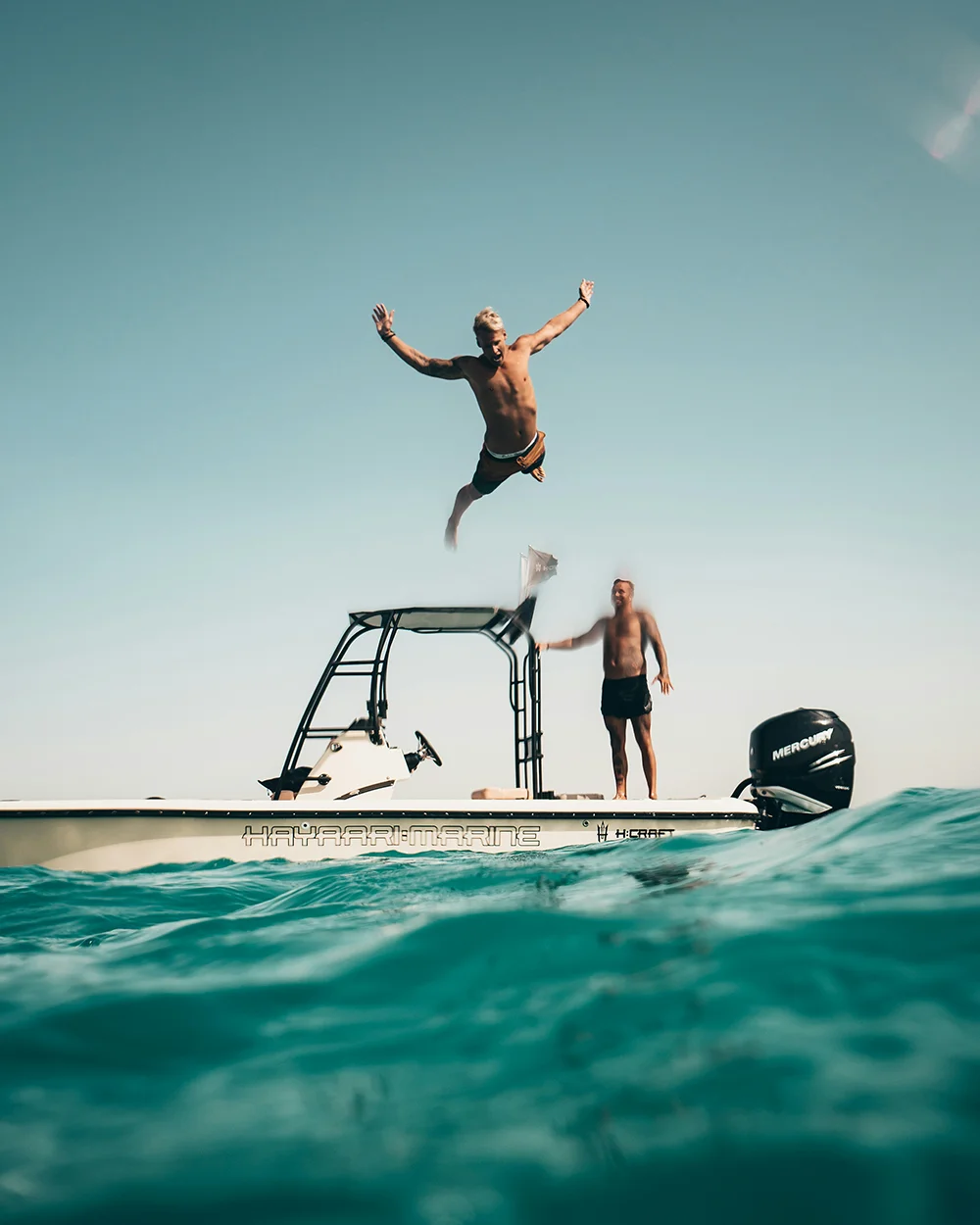 Diving off boat into water